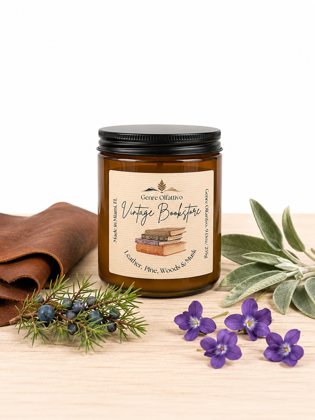 Candle jar with a label on a wooden surface with flowers and leaves
Bookish candle, library candle