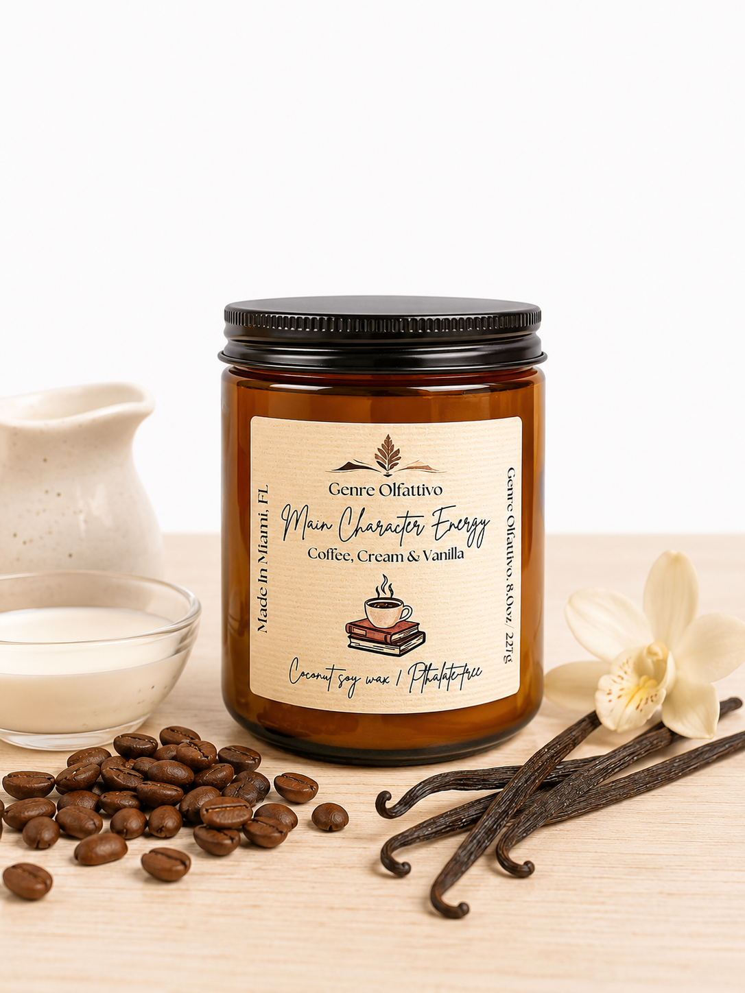 Coffee candle, bookish candle, Candle jar with vanilla beans, coffee beans, and a white orchid on a wooden surface.